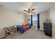 Comfortable bedroom with a ceiling fan and bookcase at 509 Powder View Dr, Ruskin, FL 33570