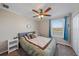 Bedroom with queen bed and ceiling fan at 509 Powder View Dr, Ruskin, FL 33570