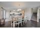 Dining area with table and chairs, kitchen and staircase views at 509 Powder View Dr, Ruskin, FL 33570
