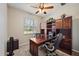 Home office with built-in wooden desk and cabinets at 509 Powder View Dr, Ruskin, FL 33570