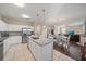 Open concept kitchen with island, stainless steel appliances, and white cabinets at 509 Powder View Dr, Ruskin, FL 33570
