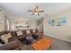Spacious living room with L-shaped sectional sofa and large wall art at 509 Powder View Dr, Ruskin, FL 33570