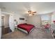 Main bedroom with king bed and rocking chair at 509 Powder View Dr, Ruskin, FL 33570