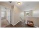 Upstairs hallway with stairs and hardwood floors at 509 Powder View Dr, Ruskin, FL 33570