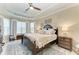 Spacious bedroom with large bed, window seating, and decorative accents at 5406 Morey Farms Loop, Palmetto, FL 34221