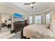 Bright bedroom with a king-size bed and large TV at 5406 Morey Farms Loop, Palmetto, FL 34221