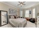 Cozy bedroom with a queen-size bed and window seat at 5406 Morey Farms Loop, Palmetto, FL 34221