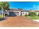 Front view of house with a large driveway at 5406 Morey Farms Loop, Palmetto, FL 34221