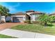 Front view of charming house with brick driveway at 5406 Morey Farms Loop, Palmetto, FL 34221
