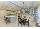 Eat-in kitchen with island seating and white cabinetry at 5406 Morey Farms Loop, Palmetto, FL 34221