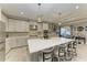 Modern kitchen with white cabinets, large island, and stainless steel appliances at 5406 Morey Farms Loop, Palmetto, FL 34221