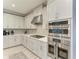 Modern kitchen with stainless steel appliances and white cabinets at 5406 Morey Farms Loop, Palmetto, FL 34221