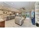 Open living room and kitchen with light wood floors at 5406 Morey Farms Loop, Palmetto, FL 34221