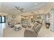Open living room with seating area, kitchen and entryway view at 5406 Morey Farms Loop, Palmetto, FL 34221