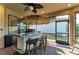 Outdoor kitchen with bar seating and grill at 5406 Morey Farms Loop, Palmetto, FL 34221