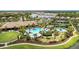 Aerial view of community pool, clubhouse, and tennis courts at 5406 Morey Farms Loop, Palmetto, FL 34221
