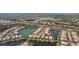 Aerial view of lakefront community with many houses at 5521 Bilbao Pl, Sarasota, FL 34238