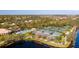 Aerial view of community tennis courts, pool, and clubhouse at 5521 Bilbao Pl, Sarasota, FL 34238