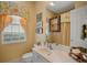 Bright bathroom with vanity, toilet, and shower at 5521 Bilbao Pl, Sarasota, FL 34238