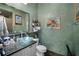 Bathroom with updated vanity and toilet at 5521 Bilbao Pl, Sarasota, FL 34238