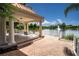 Community gazebo with seating area overlooking a pond at 5521 Bilbao Pl, Sarasota, FL 34238