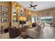 Relaxing Gathering room with built-in shelving and comfortable seating at 5521 Bilbao Pl, Sarasota, FL 34238
