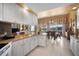 Spacious kitchen with an eat-in area and water views at 5521 Bilbao Pl, Sarasota, FL 34238