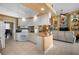 Bright kitchen with white cabinets, granite countertops, and island at 5521 Bilbao Pl, Sarasota, FL 34238