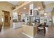 Well-equipped kitchen with white cabinets and an island at 5521 Bilbao Pl, Sarasota, FL 34238