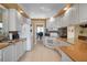 Modern kitchen featuring white cabinetry and granite countertops at 5521 Bilbao Pl, Sarasota, FL 34238