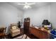 Home office with built-in cabinetry and hardwood floors at 5521 Bilbao Pl, Sarasota, FL 34238