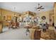 Open floor plan encompassing kitchen, dining, and living areas at 5521 Bilbao Pl, Sarasota, FL 34238