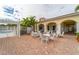 Outdoor patio with tables and chairs near pool at 5521 Bilbao Pl, Sarasota, FL 34238