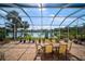 Relaxing screened patio overlooking a lake at 5521 Bilbao Pl, Sarasota, FL 34238