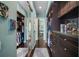 Large walk-in closet with ample storage and mirrored doors at 5521 Bilbao Pl, Sarasota, FL 34238