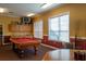 Billiard room featuring a pool table, kitchenette, and game table at 5651 Bidwell Pkwy # 201, Sarasota, FL 34233