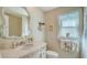 Charming bathroom with vanity, toilet and window at 6425 Stone River Rd, Bradenton, FL 34203