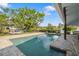 Inviting swimming pool surrounded by a spacious patio at 6926 Magellan Way, Sarasota, FL 34243