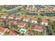 Aerial view of a planned community with houses, ponds, a golf course, and manicured landscaping at 7254 Cedar Hollow Cir, Bradenton, FL 34203