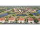 Scenic aerial view of a community featuring elegant homes, winding streets, and tranquil water features at 7254 Cedar Hollow Cir, Bradenton, FL 34203