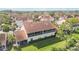 A well-maintained home with a tile roof and a screened balcony nestled within lush greenery at 7254 Cedar Hollow Cir, Bradenton, FL 34203
