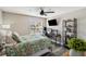 Bedroom featuring a ceiling fan, a window, and a desk setup for working from home at 7254 Cedar Hollow Cir, Bradenton, FL 34203