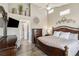 Bedroom features a large bed, dresser, and elegant decor at 7254 Cedar Hollow Cir, Bradenton, FL 34203