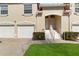 Charming townhome with a two-car garage, a well-kept lawn, and a welcoming entrance at 7254 Cedar Hollow Cir, Bradenton, FL 34203