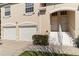 Charming townhome with a two-car garage, a well-kept lawn, and a welcoming entrance at 7254 Cedar Hollow Cir, Bradenton, FL 34203