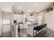 Modern kitchen with stainless steel appliances, a breakfast bar, and ample counter space at 7254 Cedar Hollow Cir, Bradenton, FL 34203