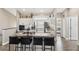 Open-concept kitchen island with sink, seating, and granite countertops at 7254 Cedar Hollow Cir, Bradenton, FL 34203