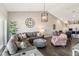 Spacious living room featuring hardwood floors, modern lighting, and comfortable seating at 7254 Cedar Hollow Cir, Bradenton, FL 34203