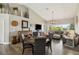 Open-concept living space with hardwood floors, bar stool seating, and comfortable seating at 7254 Cedar Hollow Cir, Bradenton, FL 34203
