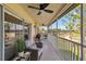 Relaxing patio with a ceiling fan, comfortable seating, and a view of the golf course at 7254 Cedar Hollow Cir, Bradenton, FL 34203